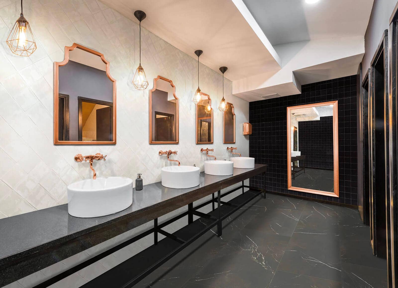 Public bathroom with pearly white tiles laid diagonally
