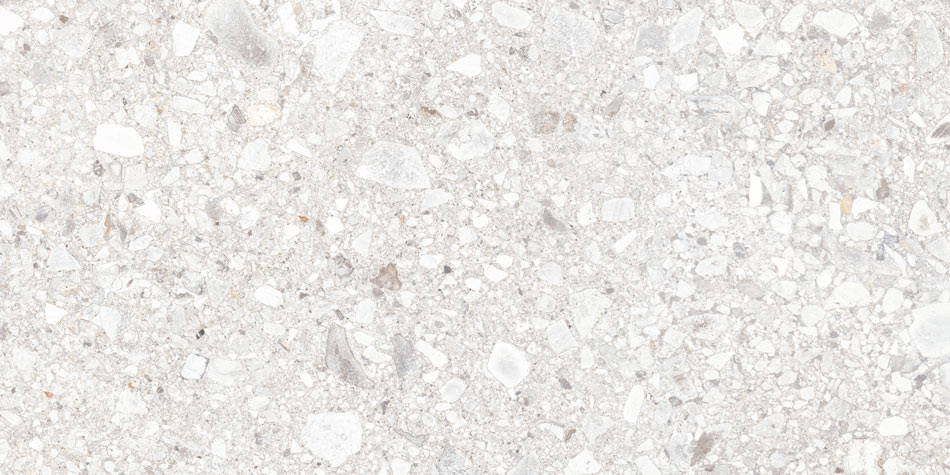 Close-up of white terrazzo-look porcelain tile featuring a textured surface with scattered stone fragments