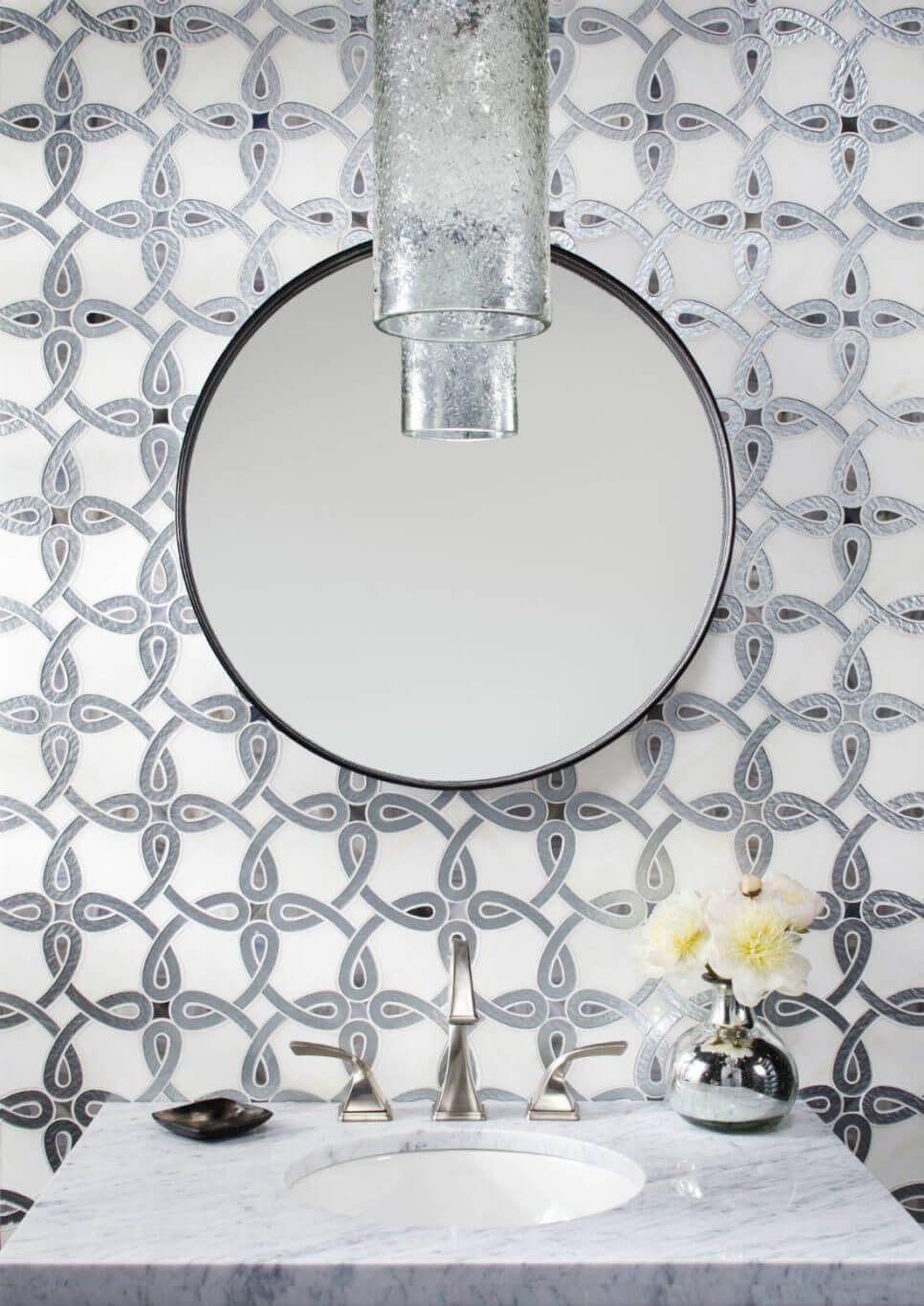 Bathroom with mosaic tile with an interlocking circle design in a metallic finish