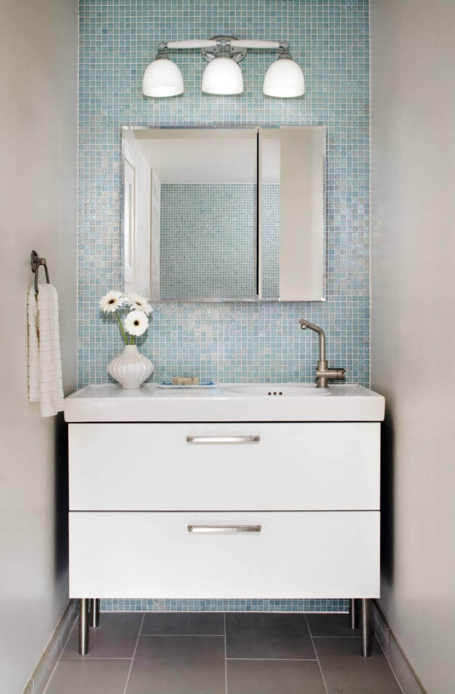 Blue powder room with mini tile grid in baby blue