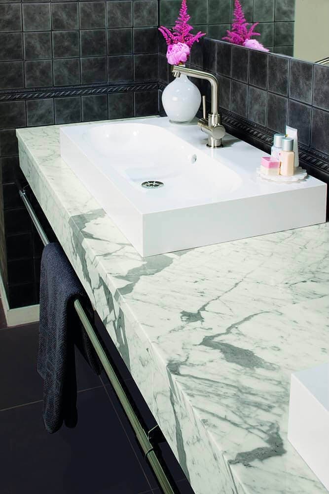 Sink with tile grid in a black stone look