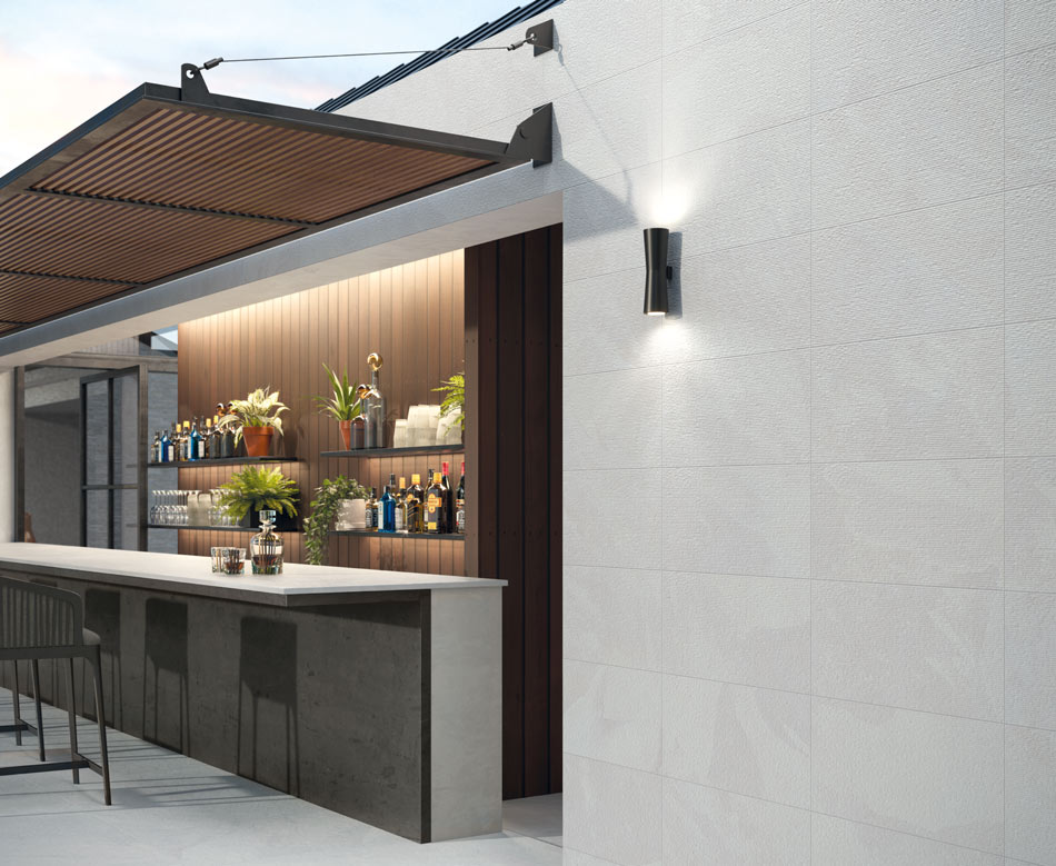 Modern outdoor bar with ivory linen-look tile walls, a gray concrete-look bar top, and wood-look tile accents
