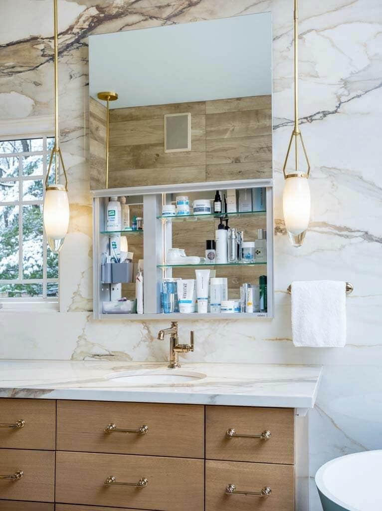 White marble-look sink bathroom with gauged porcelain tile and unique brown and gray veining