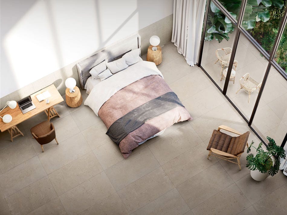 Teen bedroom with beige terrazzo-look floor tile in a neat grid extending to the patio