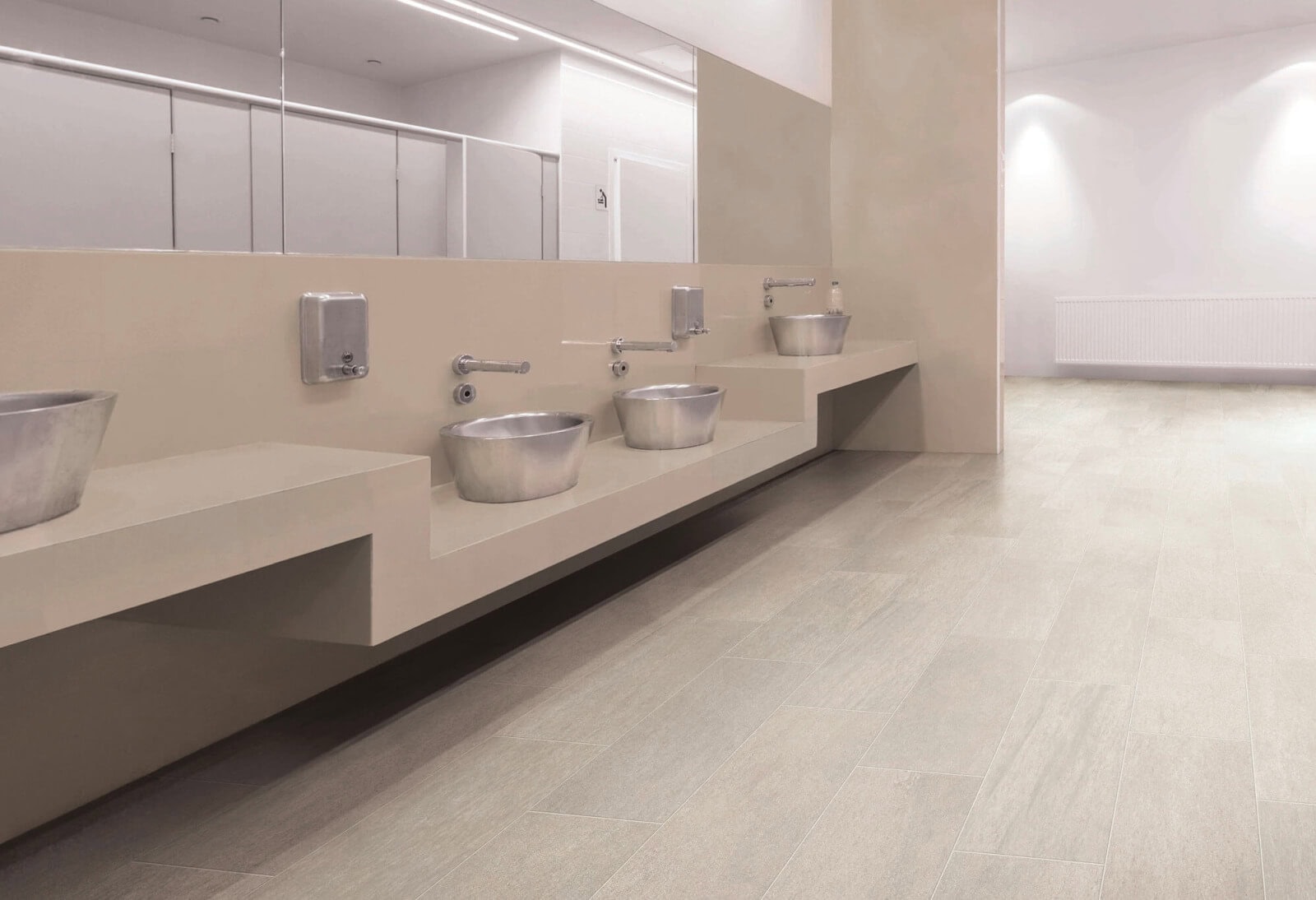 Public bathroom with tan gauged porcelain tile