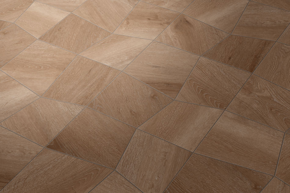 Close-up of realistic wood-look tile flooring in custom-cut geometric shapes creating dynamic movement